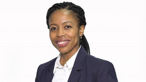 Image of an African woman in a navy suit 