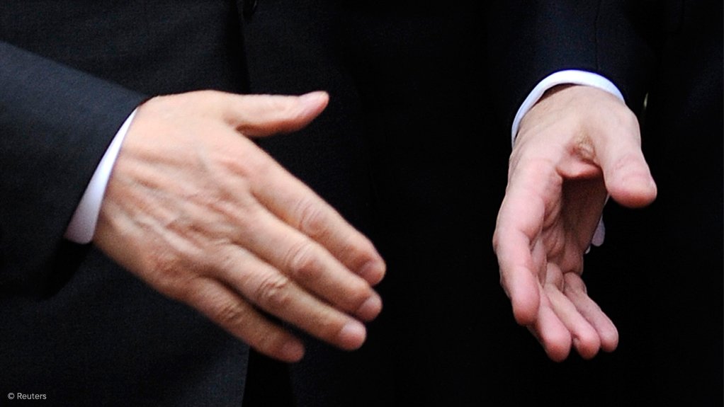 Image shows a handshake